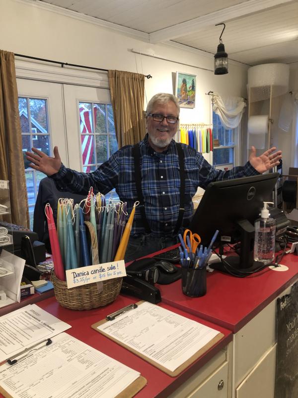 Mike Elkins, happy behind his new counter! JENNY BENNETT/Boothbay Register