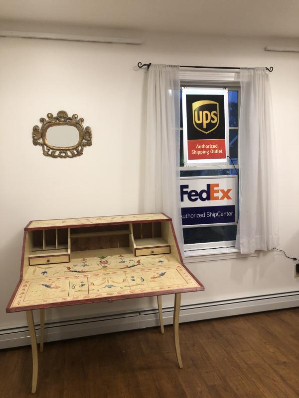 One of Elkins & Co.’s unique pieces of furniture, designed and built by Mike Elkins, decorated and finished by Jennifer Elkins, on display at the new home of Coastal Shipping. JENNY BENNETT/Boothbay Register