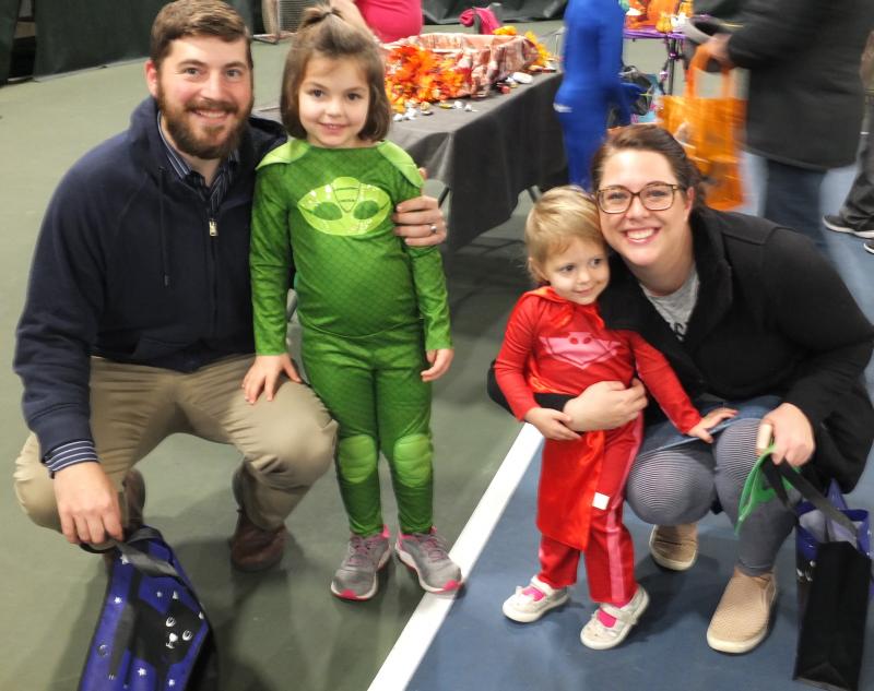 Trunk or Treat brought out families to Boothbay Region YMCA. Mike Girr with his daughter Clara dressed as Gekko of animated television series “PJ Masks.” Brittany Girr, right, poses with daughter Molly Girr, who is dressed as Owlette, also from “PJ Masks.” BILL PEARSON/Boothbay Register