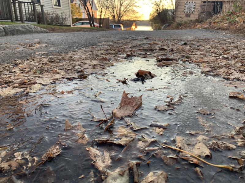 With the sun rising over the Sheepscot River in the distance, temperatures in the teens had leaves frozen in this puddle off Middle Street on Early Bird morning. SUSAN JOHNS/Wiscasset Newspaper