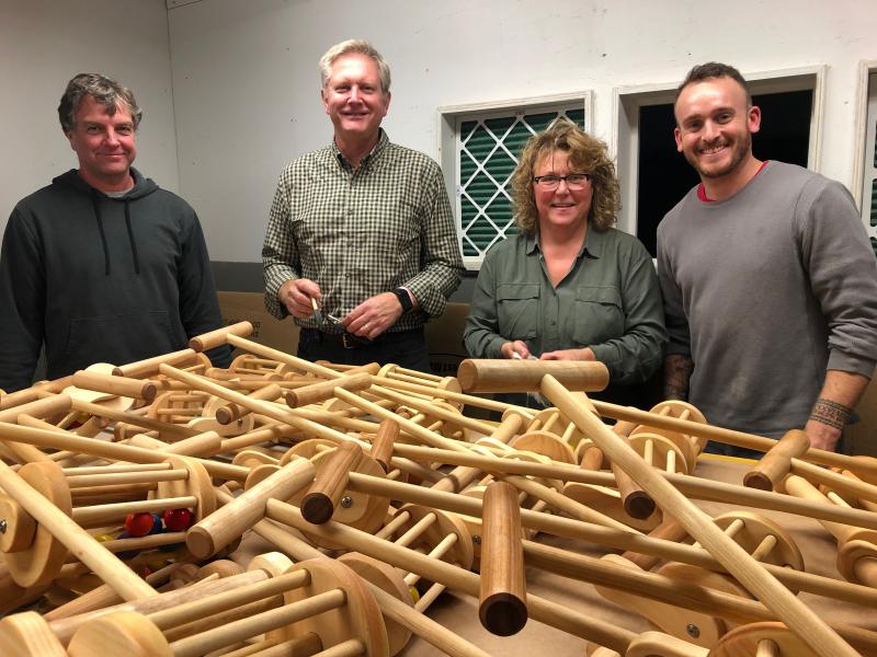 Don Oakman, Don O’Grady, Diane Hammond, and Kyle Murphy with some of the finished lawnmowers. JENNY BENNETT/Boothbay Register