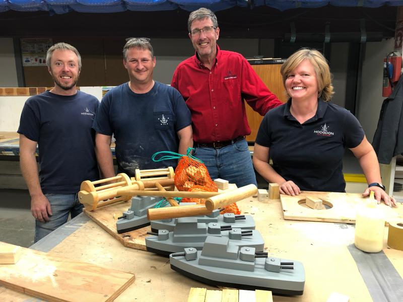 Caleb Easton, Robbie Ham, Tim Hodgdon and Jen Orchard with samples of the three toys. JENNY BENNETT/Boothbay Register
