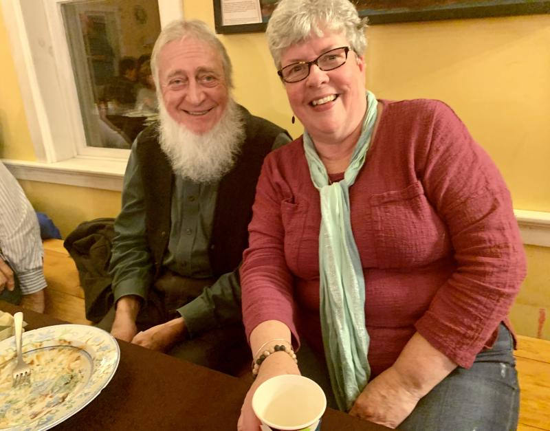 Eli Whittaker and Cindy Reynolds, both of Wiscasset, enjoy Morris Farm’s Thanksgiving potluck Nov. 21. SUSAN JOHNS/Wiscasset Newspaper