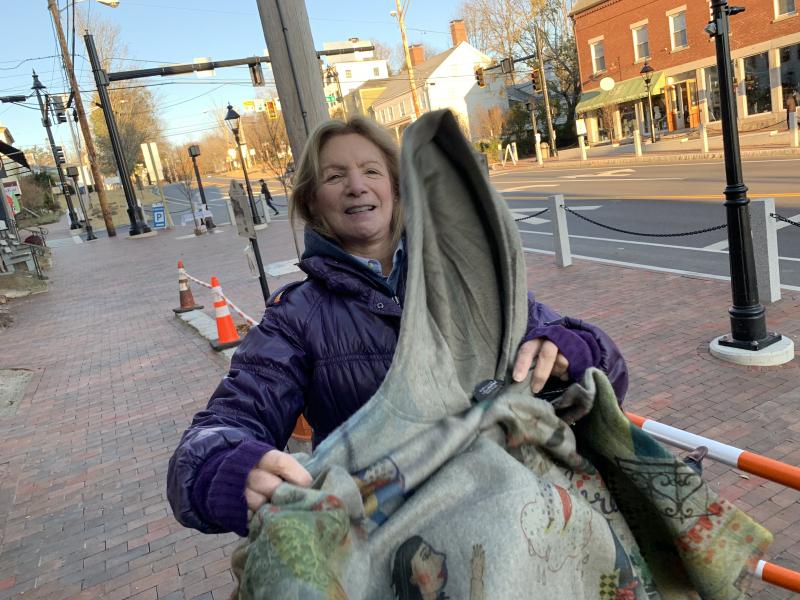Suzanne Goldenson unfurls her new poncho from DebraElizabeths. SUSAN JOHNS/Wiscasset Newspaper