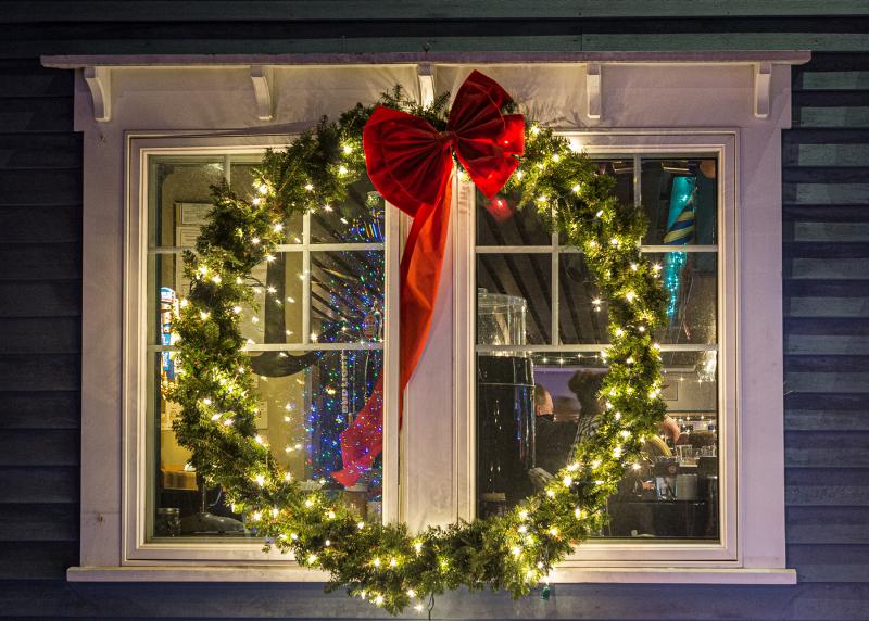 ISO 2000 1/5th - F/5.6 - I stopped down a little to gain some depth of field to have the wreath, the building and through the window all mostly in focus. Michael Leonard photo