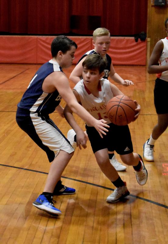 Tucker Davenport takes on a Boothbay defender. PHIL DI VECE/Wiscasset Newspaper