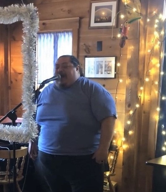Corey “Bo Bo” Tibbetts singing one of six songs at the send off party at Brady’s. Courtesy of Jen Mitchell