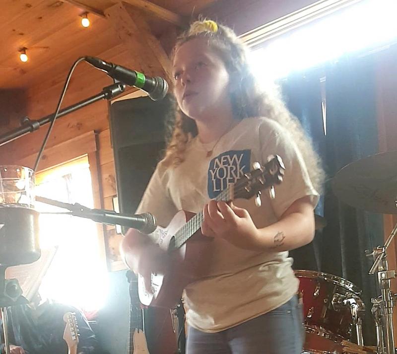 Suzie Edwards plays her ukulele while singing “Somewhere Over the Rainbow.” STEVE EDWARDS/Boothbay Register