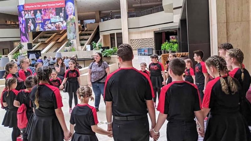 The team meets with director-choreographer Emily Mirabile before the competition. Courtesy of Emily Mirabile