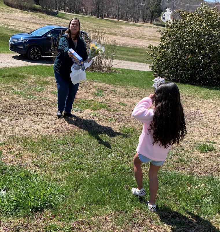 Lisa Hallinan delivers ice cream sandwiches and flowers to Kennedy Davis on her birthday. Courtesy of Breanna Davis