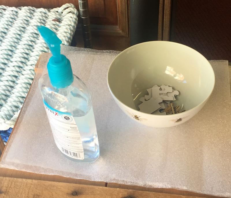 Sanitize and pick up a puzzle piece. LISA KRISTOFF/Boothbay Register
