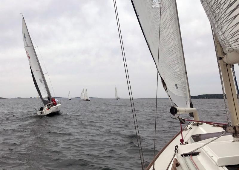 The Racing and Cruising class boats ran their races simultaneously. Pictured here is Ghost, a J/80 class racer, as to be expected is ahead at the start of Cruising Class sloop Sapphire. Courtesy of Jon Dunsford