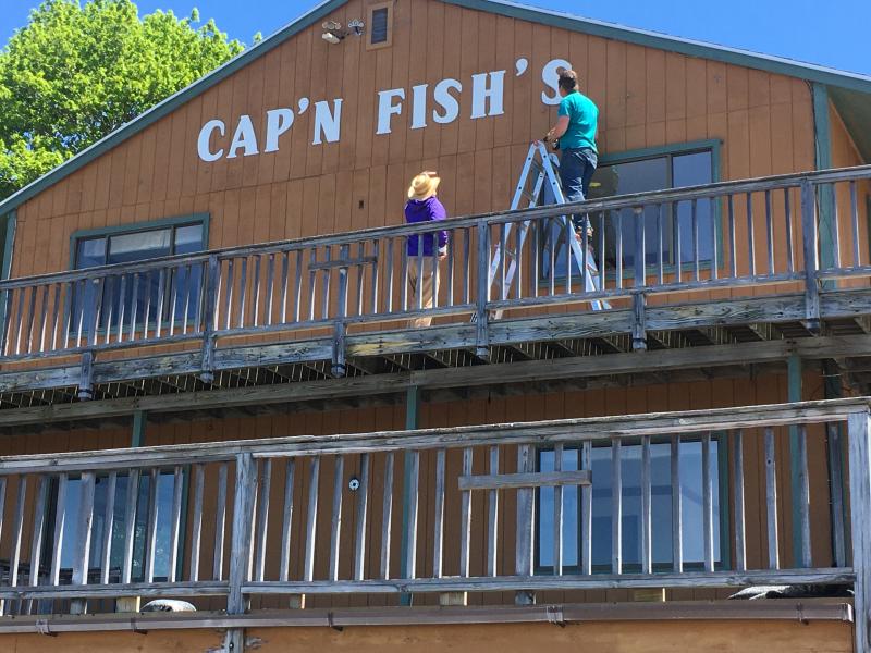 The Cap’n Fish’s sign comes down. Courtesy of Bob McKay