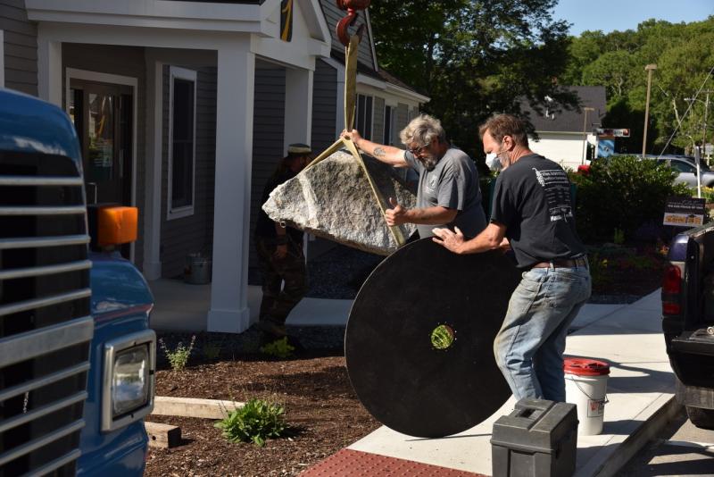 Laying the groundwork for Andreas von Huene’s “Owl” installed at The First National Bank in the early morning of July 16. Bob Crink photo