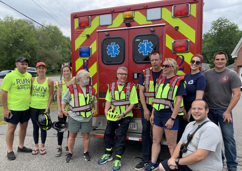 From left, Firefighter Five Foundation founder Steve Bender, fellow Pennsylvanian Lisa Steiner, Woolwich junior firefighter Hailey Namer, Woolwich Selectman Allison Hepler, Woolwich firefighter/EMT Danny Evarts, Woolwich Fire Lt. Donny Munsey, the department’s safety officer Jennifer Coombs Munsey, EMT Morgan Kindelan, firefighter Andrew Moskevitz and, in front, firefighter-EMT Rob Nibarger pose before the Wiscasset-Woolwich leg of Run2Respond Aug. 16. SUSAN JOHNS/Wiscasset Newspaper