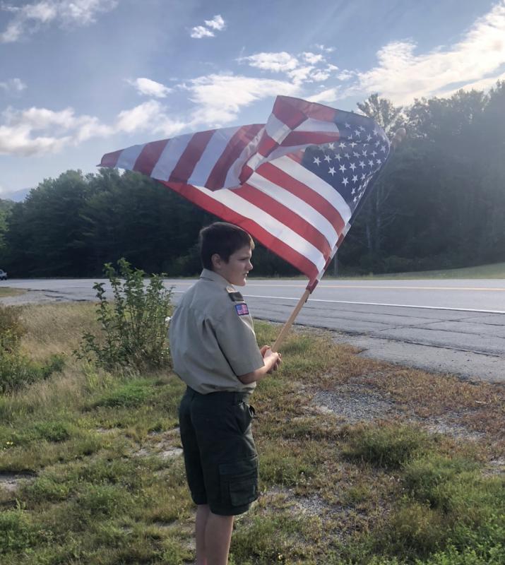 Boy Scout Jeffrey Ford flies the American flag in remembrance of 9/11. Robin Ford photo