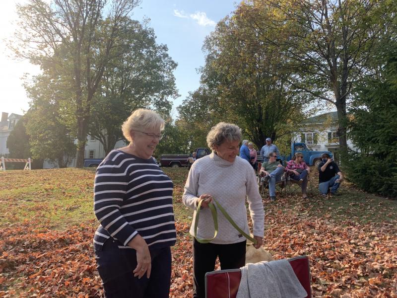 Wiscasset’s Sheila Sawyer, left, and Michelle Peele of South Bristol catch up at Scarecrowfest Oct. 10. SUSAN JOHNS/Wiscasset Newspaper