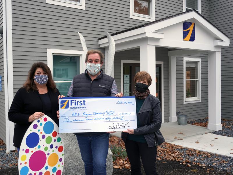 Harbor Lights: Boothbay Harbor Region Chamber of Commerce, Board Advisor, Lisa Walby, Boothbay Lights Committee Chair, Michael Maxim, and First National Bank’s EVP, Chief Administrative Officer, Susan Norton presenting a $3,750 check. Courtesy photo