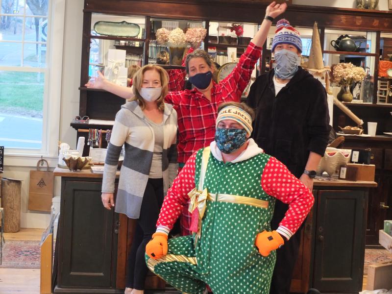 Ae Ceramics had a line waiting at the door before a 5 a.m., Nov. 14 start to the 32nd Early Bird Sale. Pictured, front, Mike Maxim. Back, from left, Lisa Best, Allison Evans and Chris Fritz. BILL PEARSON/Boothbay Register