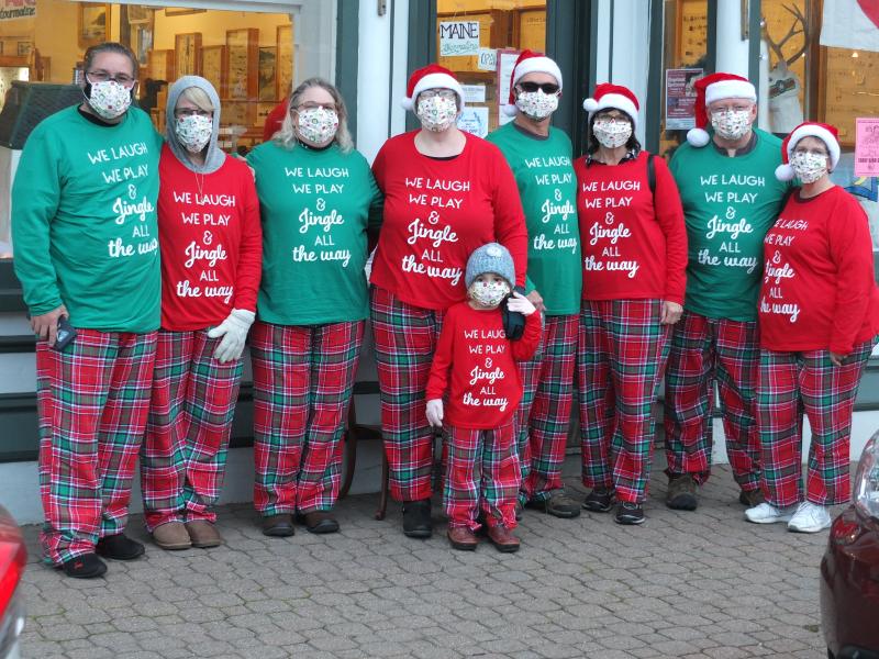 This contingent of Early Bird shoppers were the largest, greenest and reddest of all participants in the 32nd annual event. Pictured, from left, Rogel and Stephanie Negron, Jana Morehouse, Tammy Blackman Cairine Clark, Mark and Donna Bickford and John Lipofsky and Karen Lipofsky. BILL PEARSON/Boothbay Register