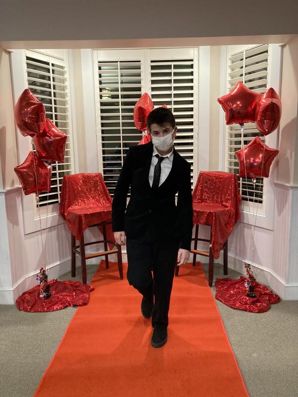 Trey Tibbetts struts down the red carpet at Water’s Edge Resort before the group enjoyed a concert by Pasek and Paul. Courtesy of Emily Mirabile