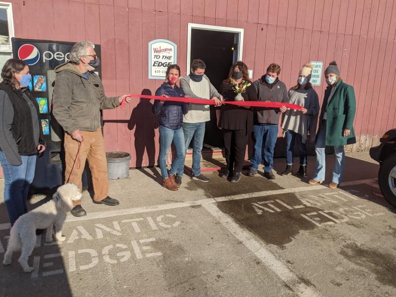 Boothbay Harbor Region Chamber of Commerce welcomes Atlantic Edge’s new owners with a Jan. 15 ribbon cutting ceremony. Pictured, from left, board member Evelyn Andrews, President Doug Goldhirsch, Atlantic Edge co-owners Kristin Page and Nick Page, Chamber Executive Director Lisa Walby, Atlantic Edge co-owner Andy Page and board members Julie Roberts and Alyssa Allen. BILL PEARSON/Boothbay Register