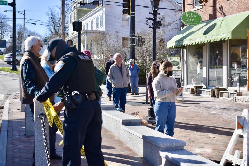 People gather on Main Street to see the damage to the Wawenock building. PHIL DI VECE/Wiscasset Newspaper