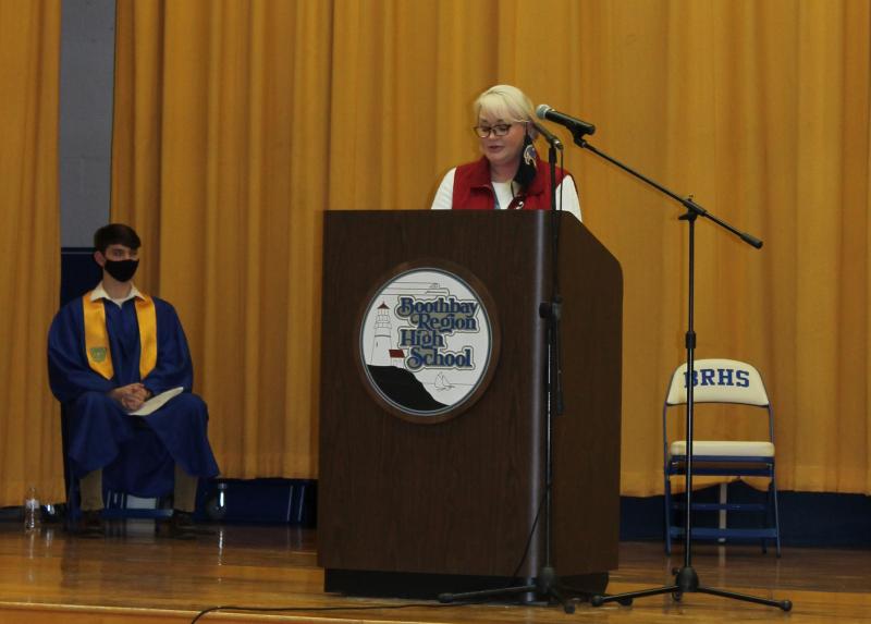 BRHS Principal Tricia Campbell speaks at the National Honor Society induction ceremony March 31. At left is member Ben Pearce. Paulette Carter photo