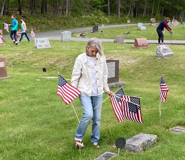 Flag placement at Evergreen Cemetery. Christopher Armstead photo