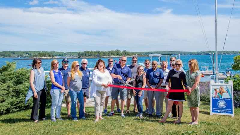 Freedom Boat Club of Maine franchise owner Steve Arnold of Yarmouth Boat Yard and Moose Landing Marina cuts the ceremonial ribbon with Boothbay Harbor Region Chamber of Commerce at FBC’s landing point, Linekin Bay Resort. Courtesy photo