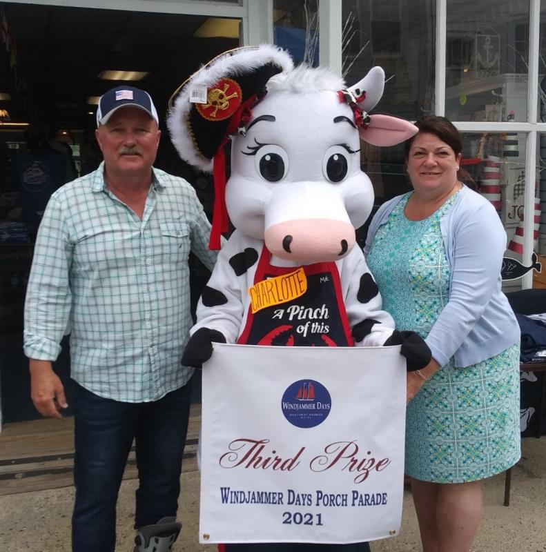 Third place went to The Smiling Cow. Mark Gimbel and friend accepted the award from Lisa Walby July 9. Courtesy of Boothbay Harbor Region Chamber of Commerce