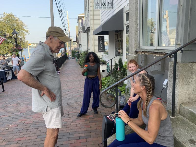 Summer Wiscasset resident Frank Barnako speaks with Dance Maineia after a performance early in the art walk. SUSAN JOHNS/Wiscasset Newspaper