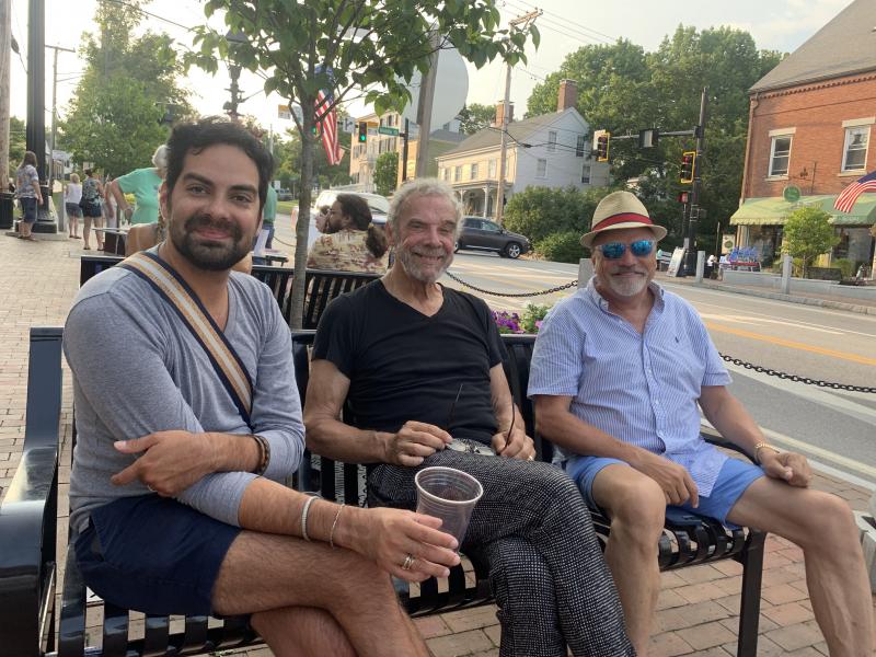 From left, Philip Hannel and Tim Womboe, both of Houston, Texas, and Chris Erickson of Wiscasset take in the Aug. 26 Wiscasset Art Walk. SUSAN JOHNS/Wiscasset Newspaper