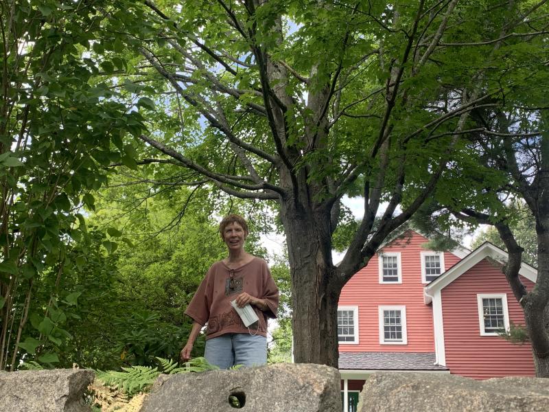 Lucia Droby spots Wiscasset Newspaper taking her photo at the Sunken Garden. SUSAN JOHNS/Wiscasset Newspaper