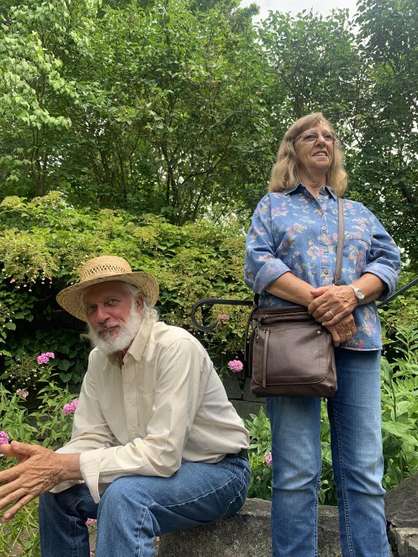 Steve and Carolyn Fife take in music in the Sunken Garden Aug. 18, the start of Schoonerfest in Wiscasset. SUSAN JOHNS/Wiscasset Newspaper