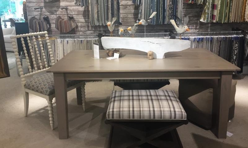 Dining room table with a fun Jeff Barrett sculpture. LISA KRISTOFF/Boothbay Register COVE by Knickerbocker Group