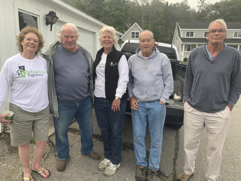 Rebuilding Together-Lincoln County held its annual day promoting maintenance projects on the peninsula on Sept. 25. Pictured, from left, are Sarah Giles, Vic Taylor, Sally Barter, and Alan and Andrew Miller. BILL PEARSON/Boothbay Register