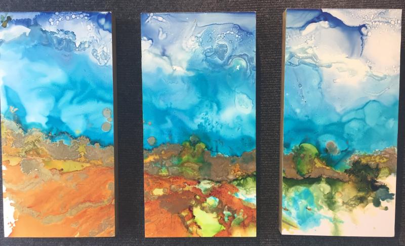 Helen Warner’s triptych, “Evolution” in alcohol ink. Helen Warner