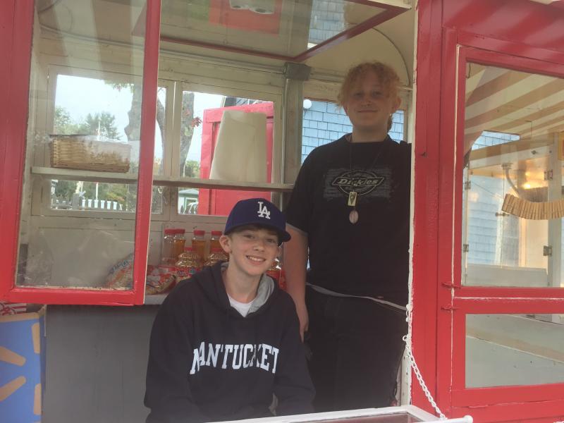 Manning the popcorn and hot dog booths are Sam Markowitz, left, and Leo Johnson. LISA KRISTOFF/Boothbay Register