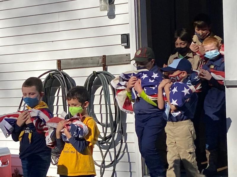 Boy Scout Troop 213 in a procession to dispose of retired American flags by burning at the Nov. 11 ceremony at American Legon Post 36 in Boothbay. JOSEPH CHARPENTIER/Boothbay Register