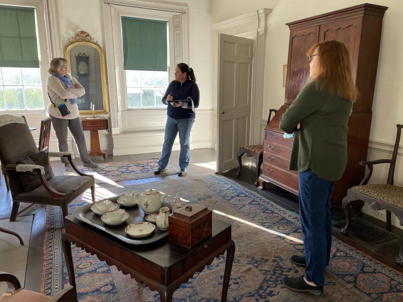 From left, historical consultant Lisa Welter, floral designer Laura Tibbetts and Nickels-Sortwell house manager Peggy Konitzky discuss the history and furnishings of the house as Tibbetts prepares to decorate the house in holiday greens for tours during Wiscasset Holiday Marketfest, Dec. 3-5. Marketfest photo