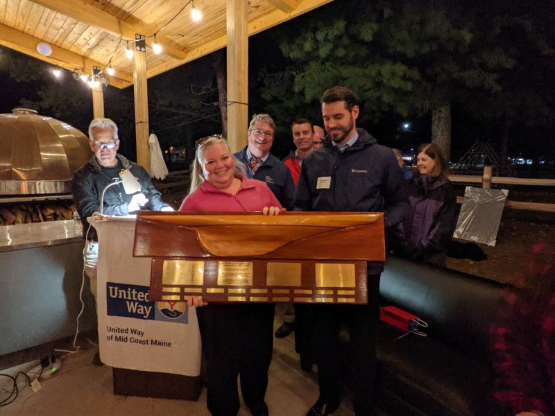 Bath Savings receives United Way’s Campaign Excellence Award. Co-chairs Megan Smith-Pinkham and Dan Wilson hold the Award, with fellow Bath Savings employees behind them. United Way Campaign Co-Chair Bob McCue is at left. Courtesy of Barbara Reinertsen