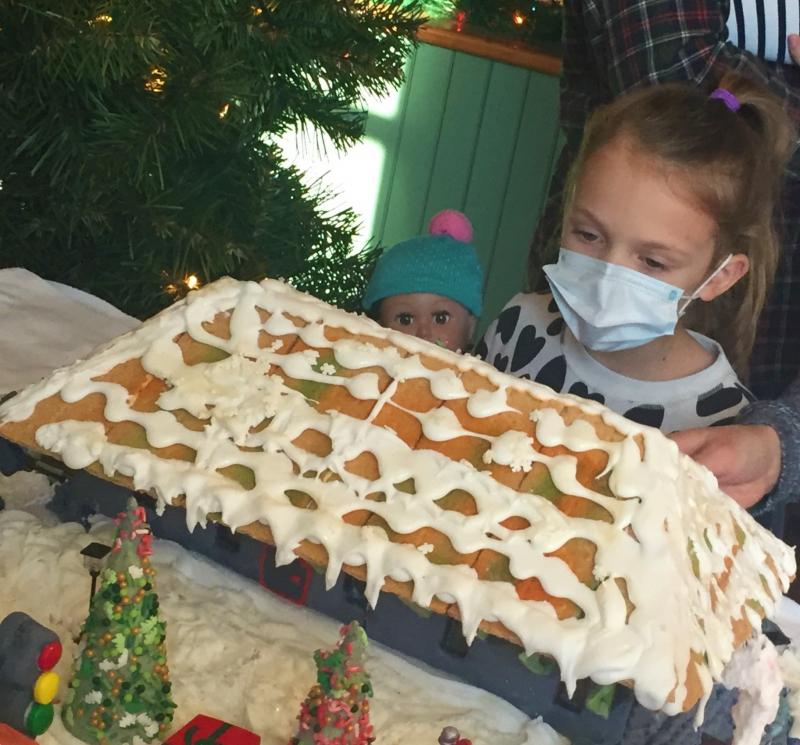 Marina and her bestie check out a gingerbread. LISA KRISTOFF/Boothbay Register