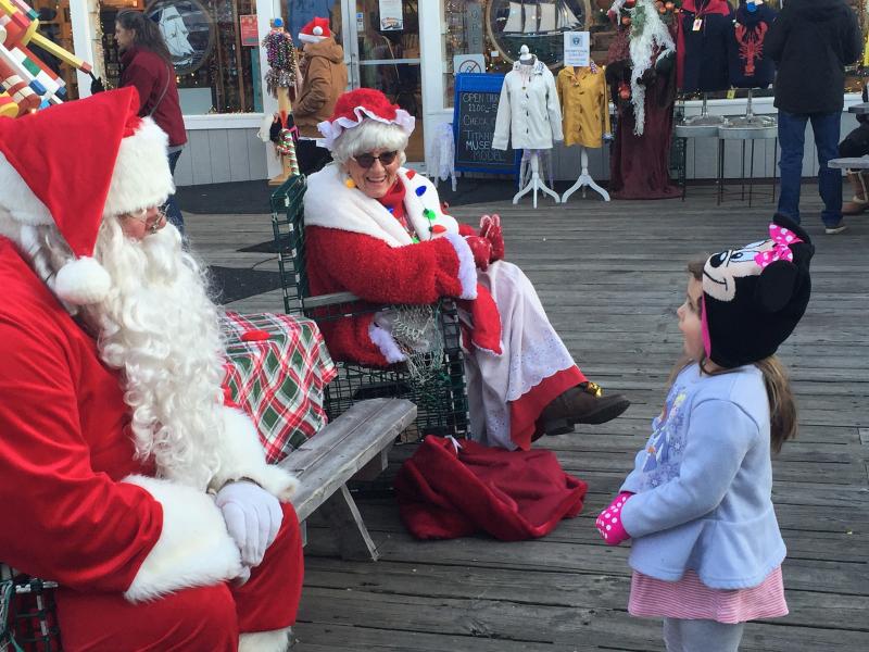 This young girl chose to speak to Santa and Mrs. Claus simultaneously - and did so with great charm. LISA KRISTOFF/Boothbay Register