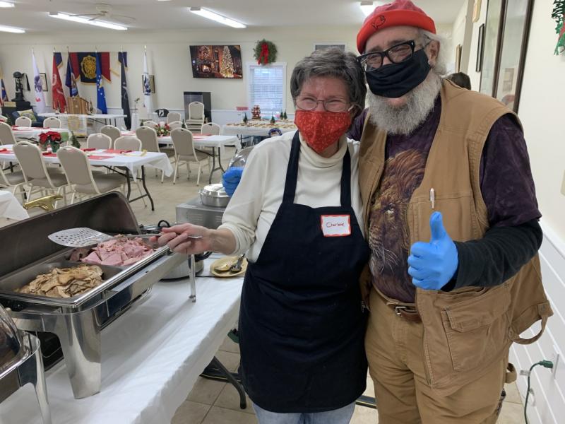 Christine Franz and “Big Al” Cohen were among the 20 volunteers serving a community Christmas dinner at the Boothbay American Legion Hall. BILL PEARSON/Boothbay Register