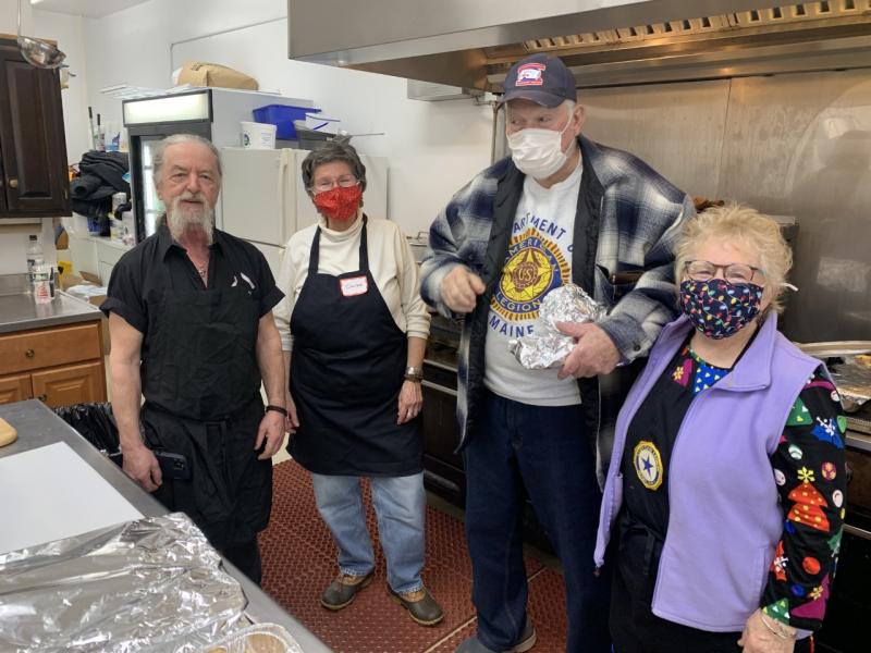 The American Legion Hall kitchen was full with volunteers cooking up a community Christmas dinner. From left are Mark Rigas, Christine Franz, Ed Harmon and Nancy Van Dyk. BILL PEARSON/Boothbay Register