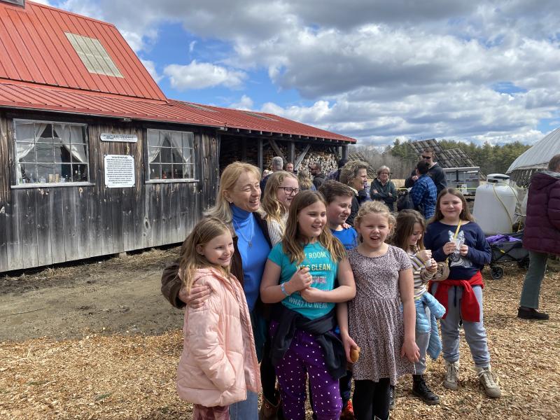 Gov. Janet Mills takes a photo with guests at Goranson Farm in Dresden March 27. Courtesy photo