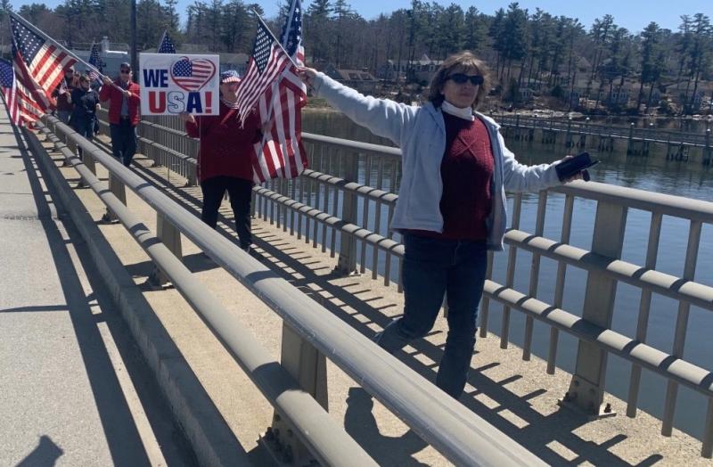 Local patriots celebrate Patriots’ Day April 18 by carrying flags and walking across Donald E. Davey Memorial Bridge from Wiscasset to Edgecomb. BILL PEARSON/Boothbay Register