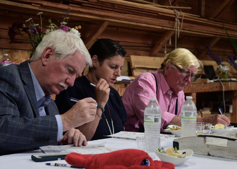 The Claw Down judges – Bill Green, Vanessa Santanelli of Your Maine Concierge and Capt. Rusty Court – hard at work. Bob Crink photo