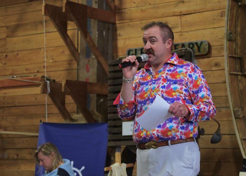 Master of Ceremonies Michael Maxim makes an announcement at Claw Down. Bob Crink photo